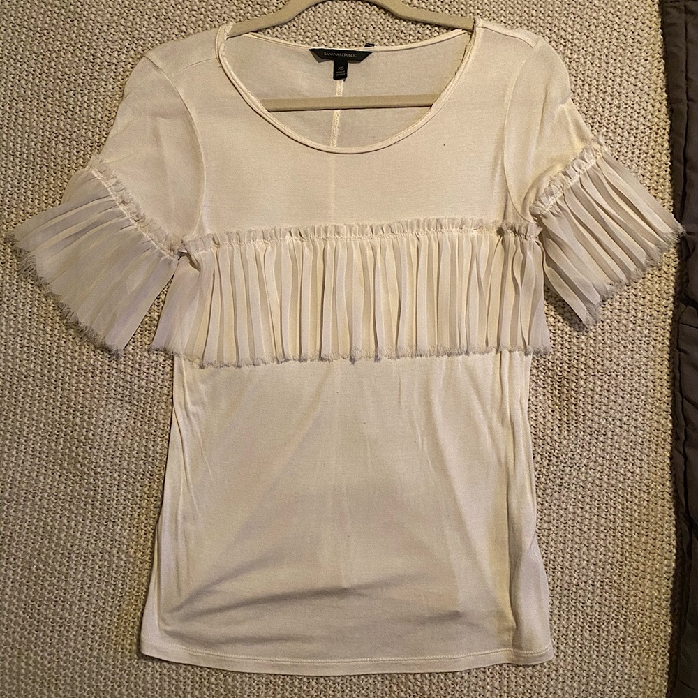 Off-white blouse with ruffle details